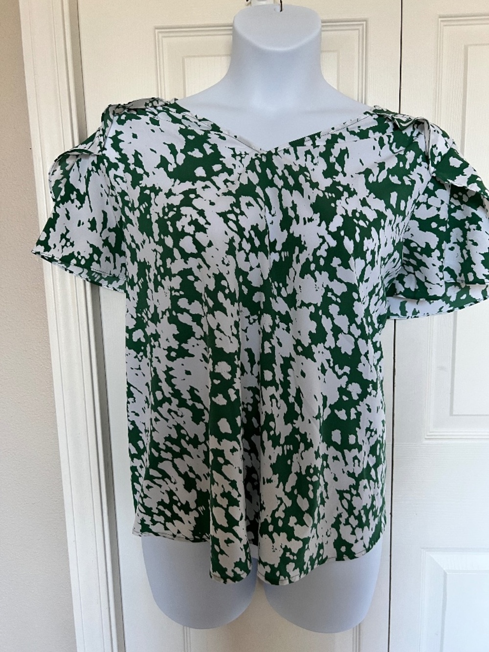 Green and white blouse